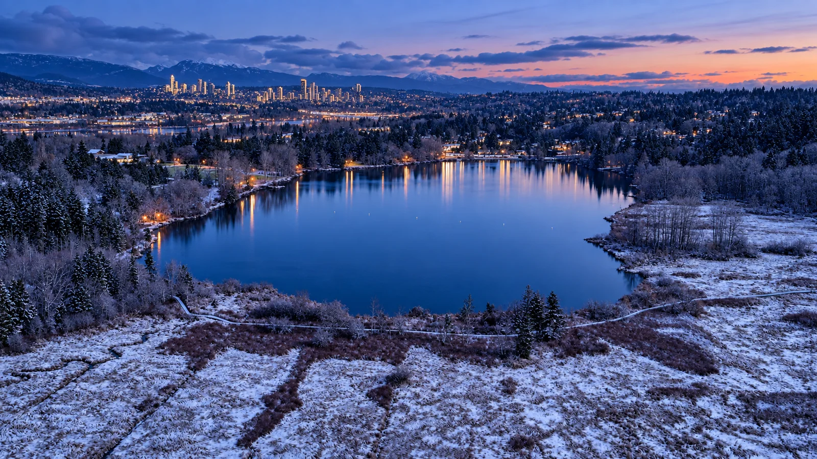 Aerial view of Deer Lake with forest, trails, and civic spaces in Burnaby