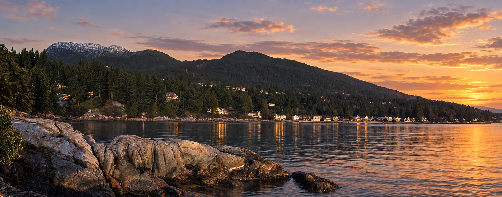 Rocky Caulfeild Park waterfront with forested shorelines and mountains across the water
