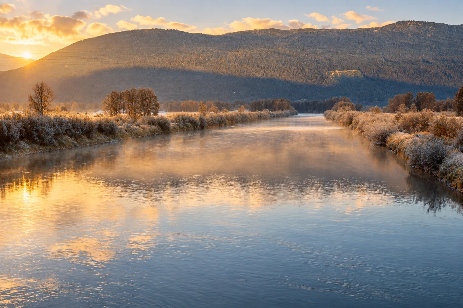 Vedder River flowing through Chilliwack with a forested mountain backdrop